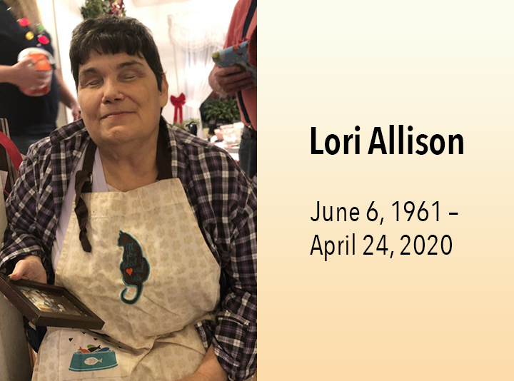 Lori, sitting and smiling. June 6, 1961 - April 24, 2020.