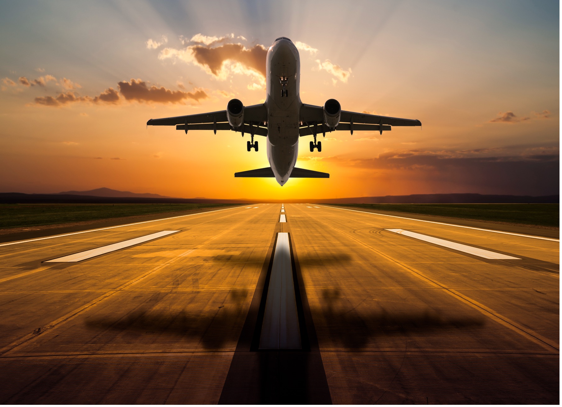 An airplane taking off at dusk