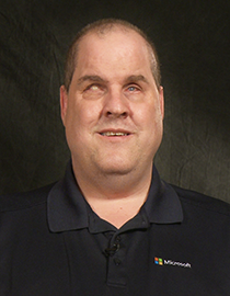 Board Member Jeff Bishop wearing a dark-colored shirt