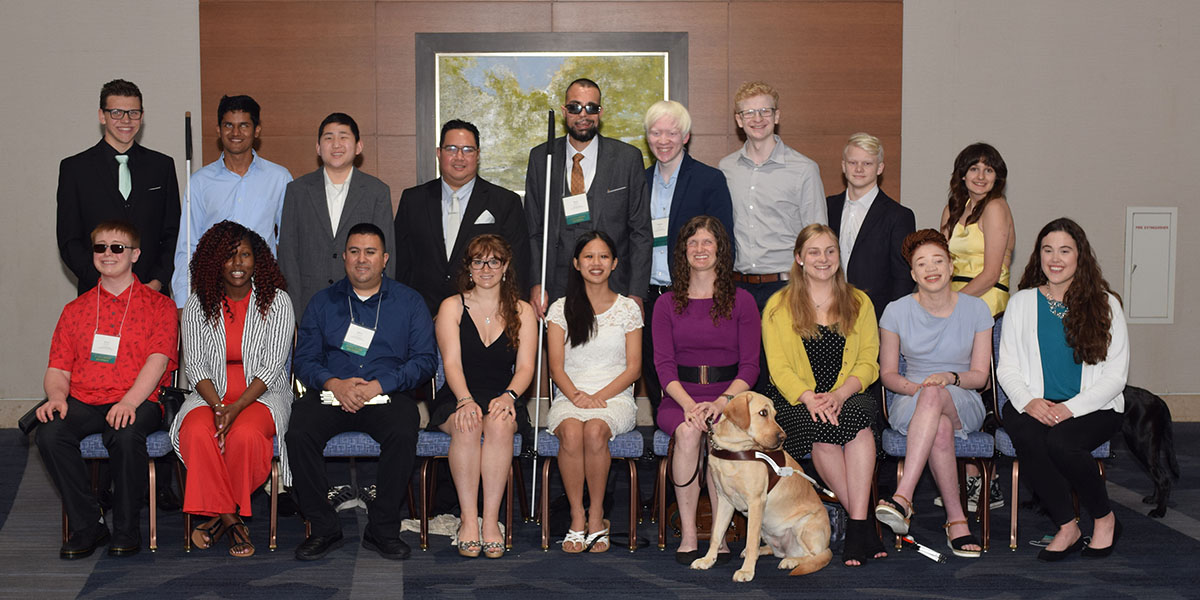 A group of smiling scholarship recipients during convention.