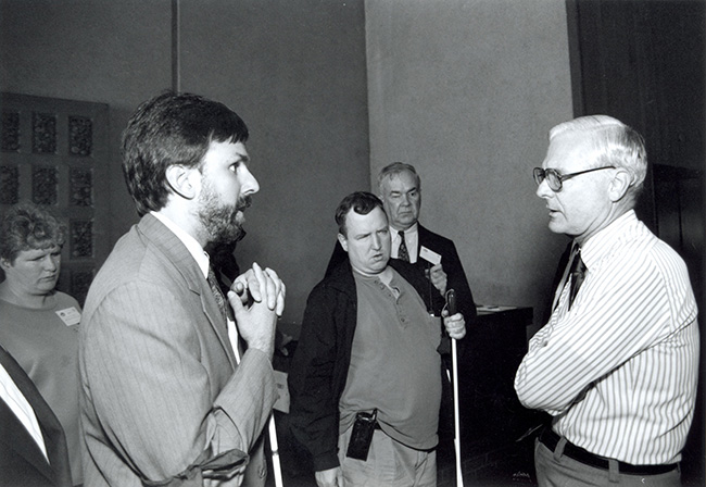 Jean Mann, Paul Schroeder, Scott Marshall, and Oral Miller talk about safety on mass transit with Secretary of Transportation Federico Pena in his office at the San Francisco convention in 1993.