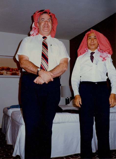 Oral Miller tries on a Saudi Arabian headscarf, along with another delegate to the joint meetings of the World Council for the Welfare of the Blind and the International Federation of the Blind. At this 1984 meeting, the groups merged to become the World Blind Union. Miller headed the WCWB resolutions committee.