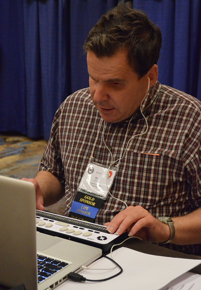 Person using a technical device designed for blind