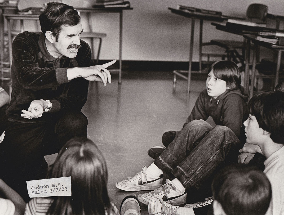ohn telling one of his famous stories to a classroom of children